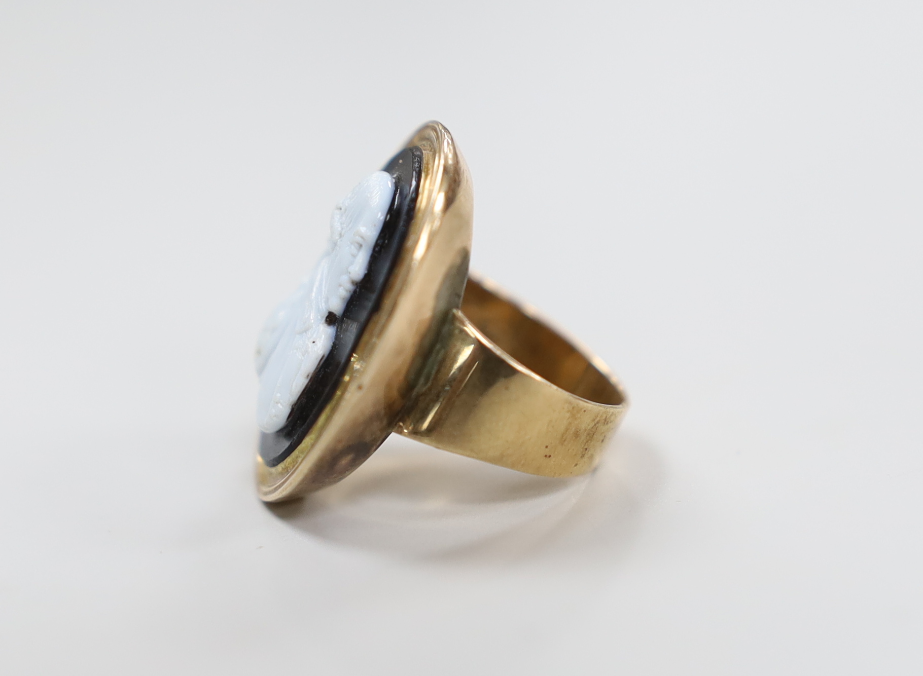 A 19th century and sardonyx cameo set oval ring, carved with the bust of a gentleman to sinister, size F/G, gross weight 8.9 grams.